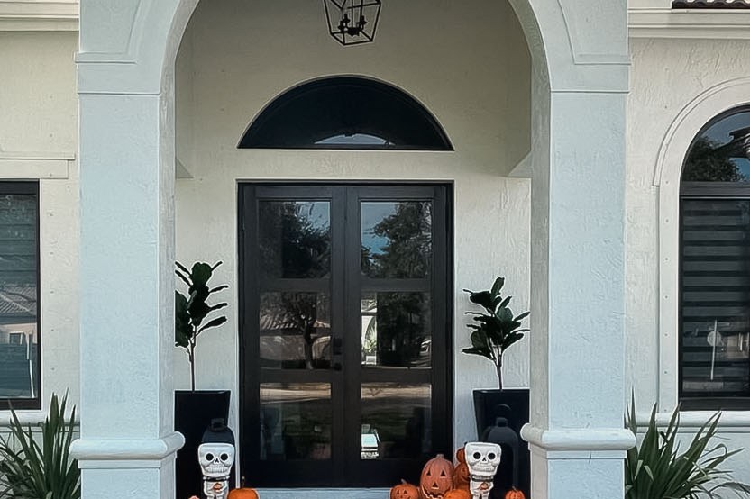 Entry before — standard glass double door on the same Orlando home